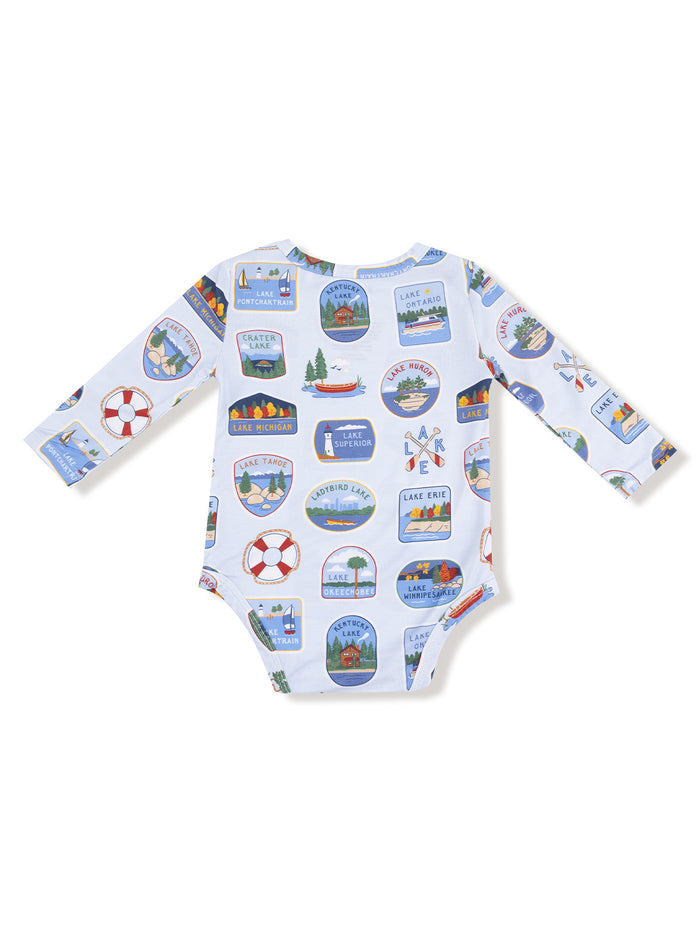 Long-sleeve toddler onesie with a colorful lake-themed print featuring various lake names and icons.