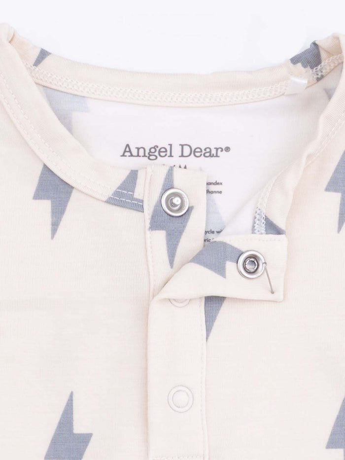 Cream-colored fabric with gray lightning bolt patterns and a snap closure from the brand Angel Dear.