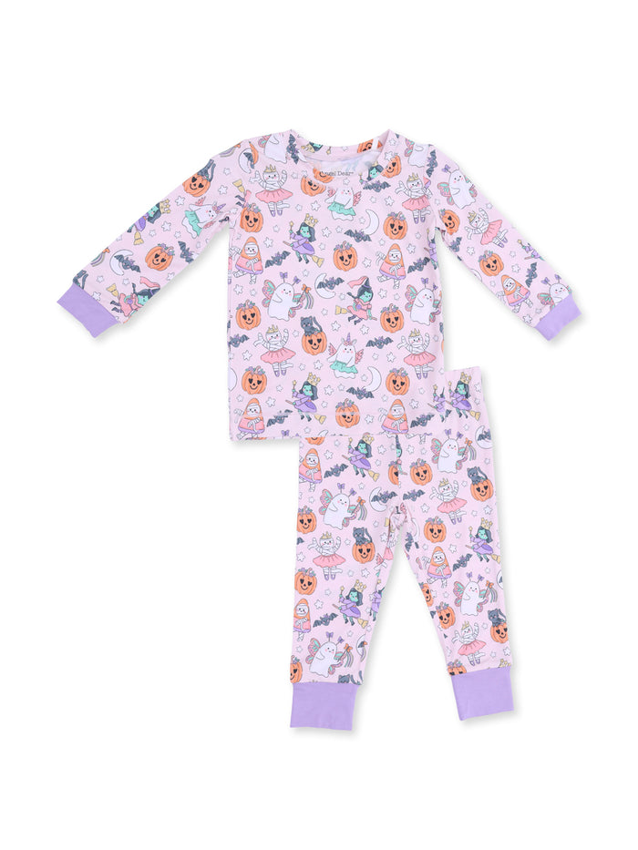Children's Halloween-themed pajamas with colorful patterns of pumpkins, witches, and cute characters on a light purple background.