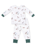 Kids' pajama set featuring playful dog and nature prints on a white background with green cuffs.