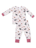 Kids' pajama set featuring playful animal and nature patterns in soft pastel colors.
