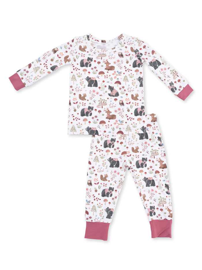 Kids' pajama set featuring playful animal and nature patterns in soft pastel colors.