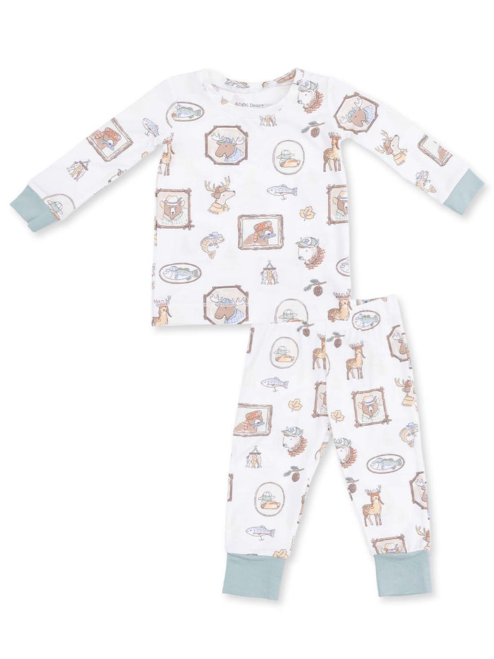 Cozy children's pajama set with illustrated woodland animals and nature-themed patterns on a white background.
