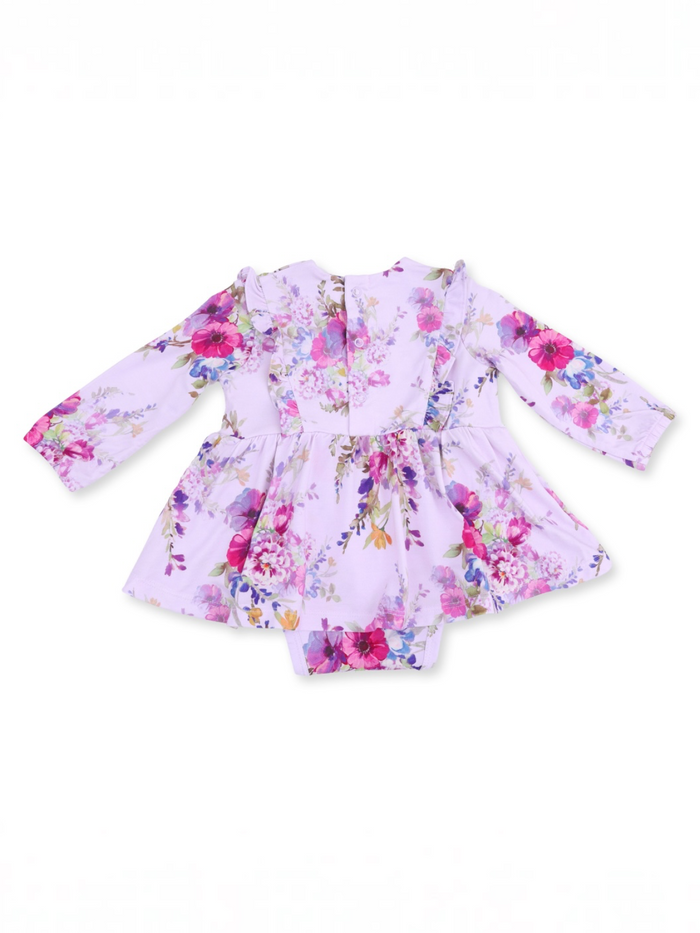 Floral baby dress with long sleeves, featuring a lilac background and vibrant pink and purple flowers.