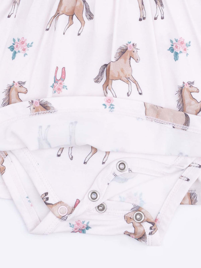 Baby onesie with a horse and floral pattern, featuring snap closure at the bottom.