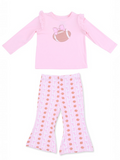 Pink long-sleeve top with ruffles and football graphic, paired with matching pajama pants featuring football print.