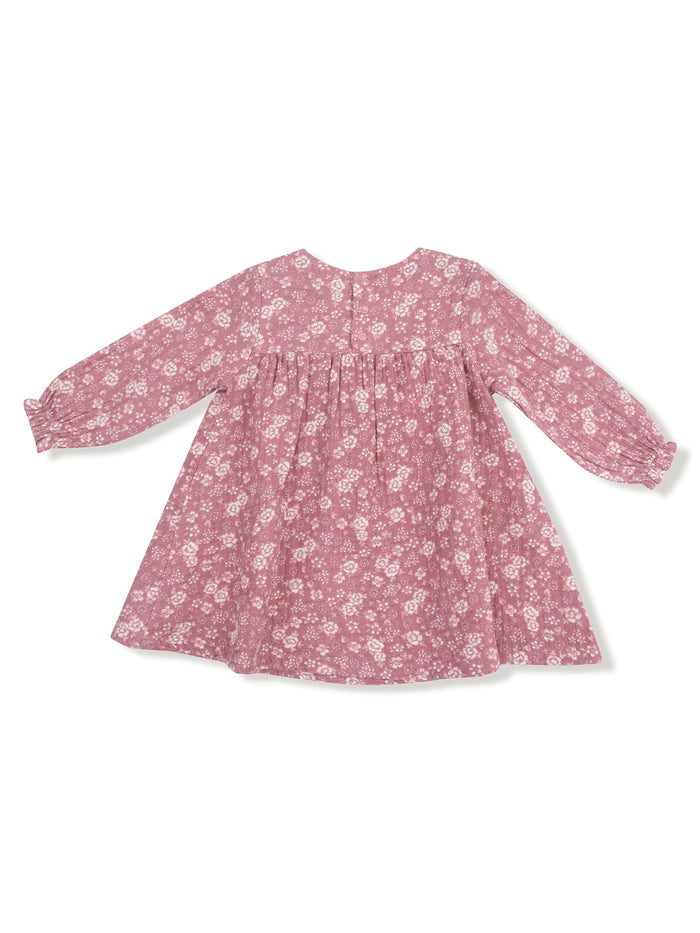 Pink floral dress with long sleeves and gathered skirt, viewed from the back. Ideal for casual or special occasions.