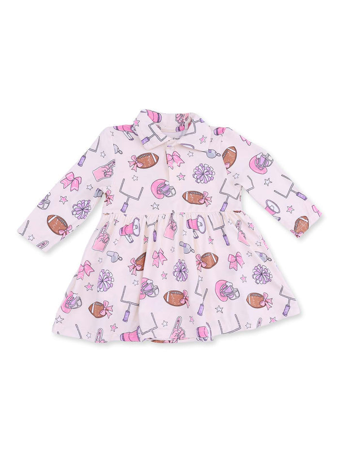 Pink dress with playful sports-themed patterns, including footballs, cheerleading bows, and pom-poms.