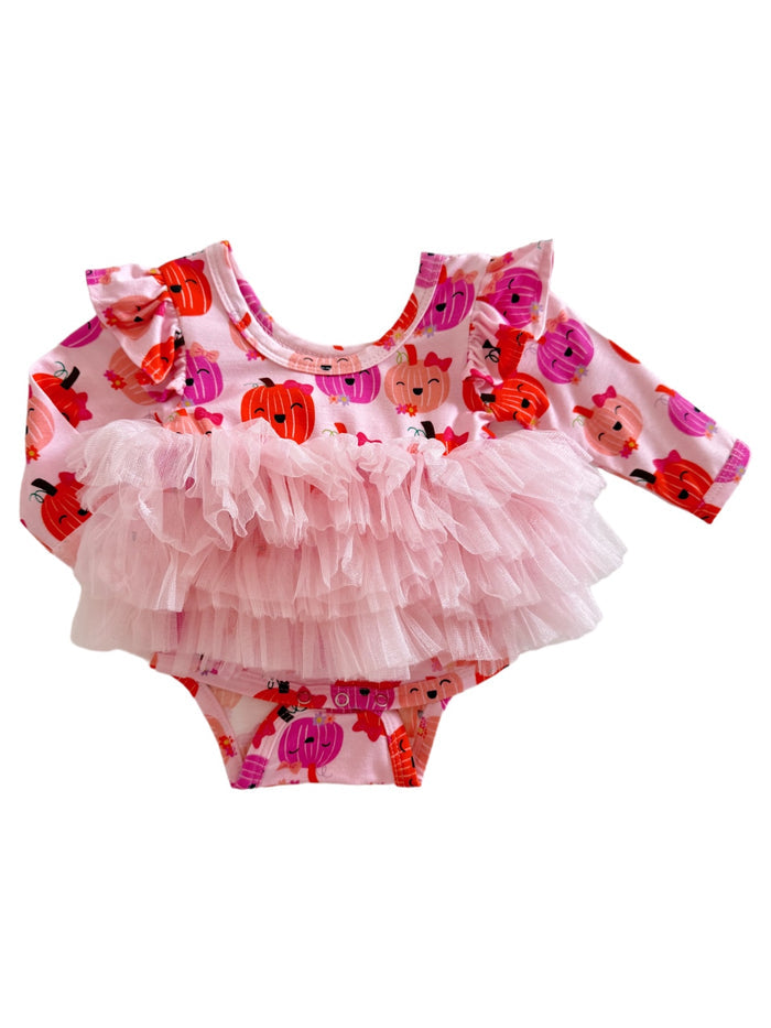 Pink onesie with pumpkin print and a fluffy tulle ruffle skirt for infants. Perfect for fall-themed outfits.