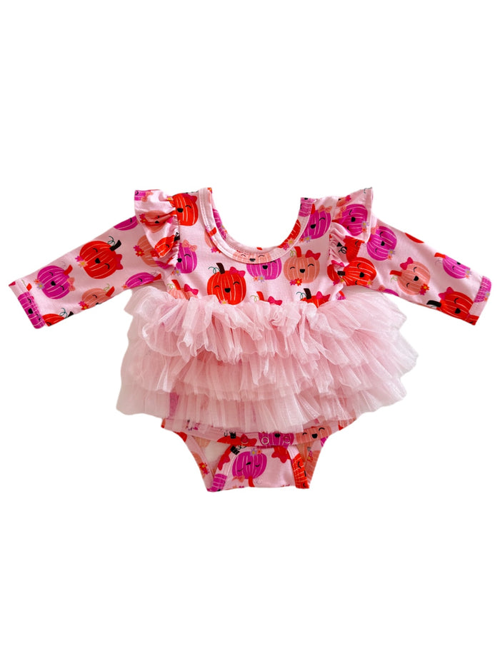 Pink dress with ruffled sleeves, featuring pumpkin patterns and a tulle overlay for a cute, festive look.
