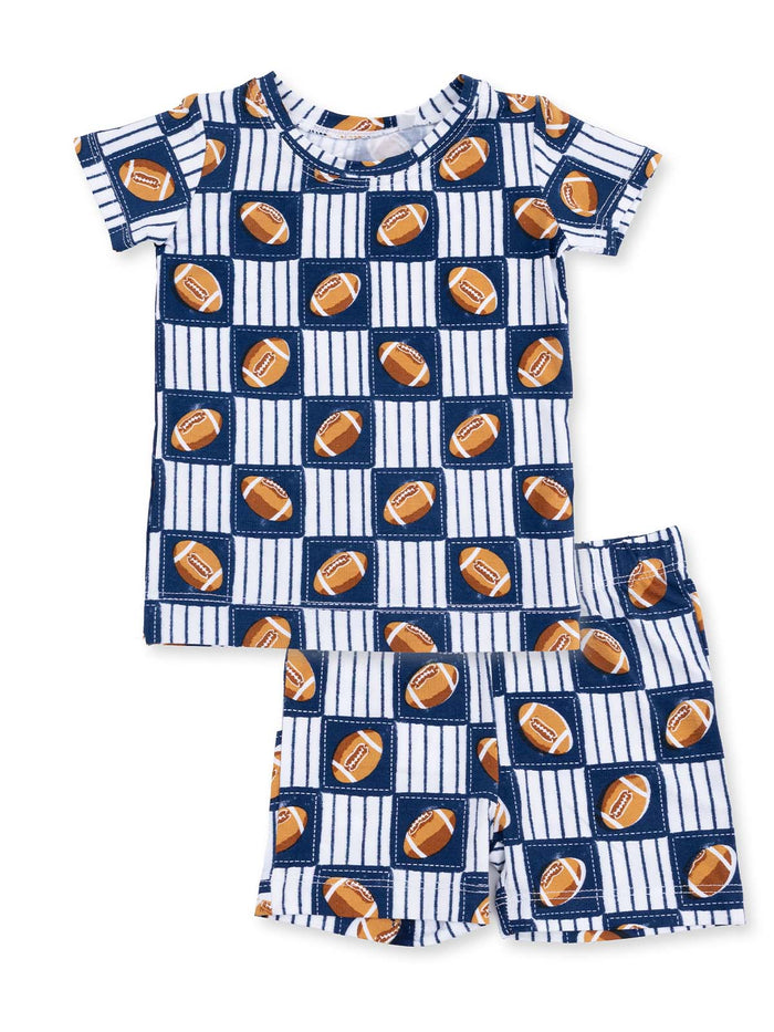 Boys' pajama set with football pattern, featuring a short-sleeve top and shorts in navy and white.
