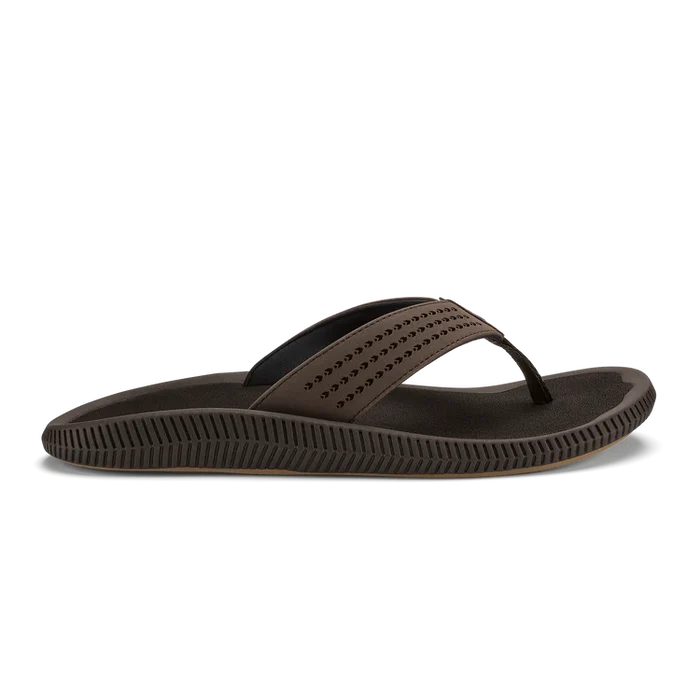 Brown sandal with a black strap on a white background