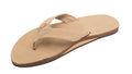 Beige sandal with a decorative strap on a white background