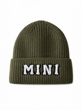 Olive green knit beanie hat with the word "MINI" embroidered on the front.