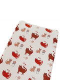 Patterned fabric featuring playful cats in various poses with plants and yarn.