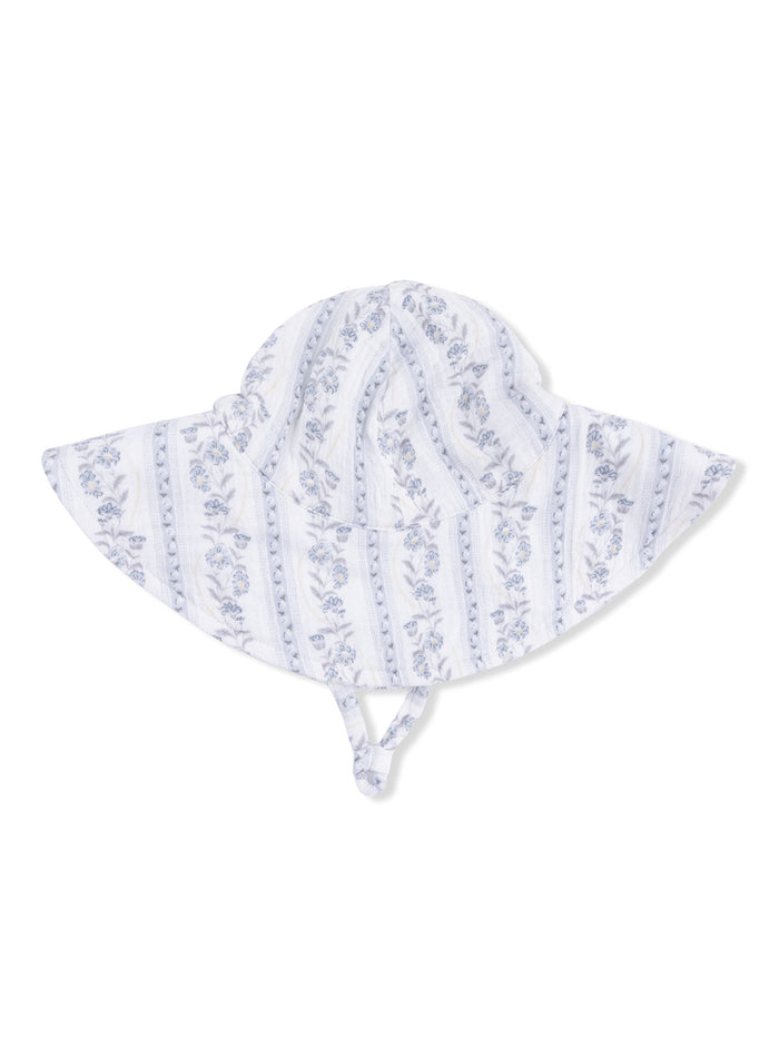 Floral patterned wide-brim hat with ties, ideal for sun protection.