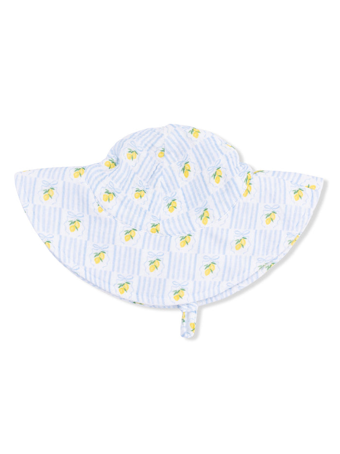 Blue and white striped sun hat with lemon print, featuring a wide brim and tie for secure fit.