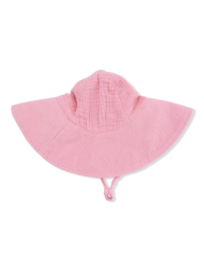 Pink children's sun hat with a wide brim and adjustable chin strap, viewed from the back.
