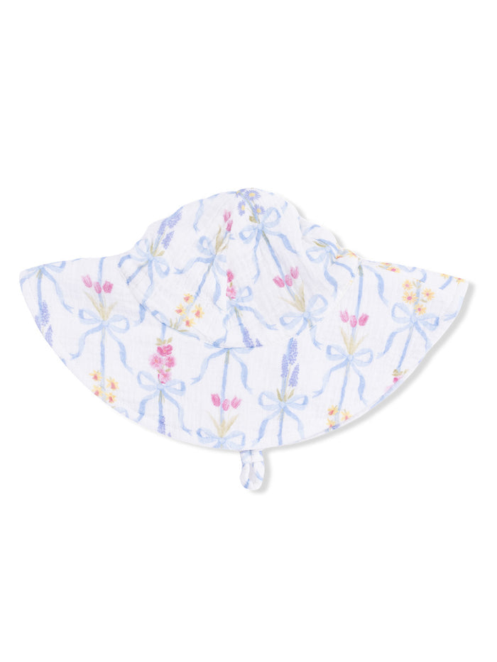 White sun hat with floral pattern and blue ribbons, designed for sun protection and stylish outdoor wear.
