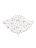 Floral white sun hat with yellow flowers, wide brim, and chin strap. Perfect for sunny days outdoors.