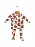 Gingerbread-patterned baby outfit on hanger, featuring long sleeves and matching pants.