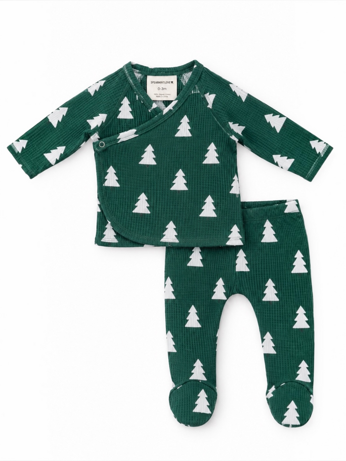 Green baby outfit with white tree patterns, including a wrap top and footed pants, designed for 0-3 months.