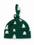 Green knit baby hat with white Christmas tree pattern and knot on top.