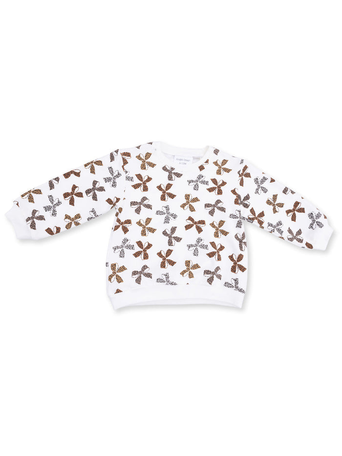 White sweatshirt with colorful floral and leopard print patterns across the fabric.