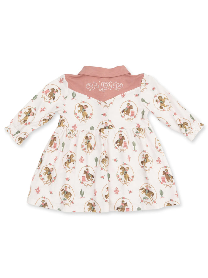 White dress with cowboy pattern and pink collar, featuring a western-themed design and floral accents.