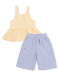Yellow peplum top paired with blue gingham shorts, designed for comfort and casual summer wear.