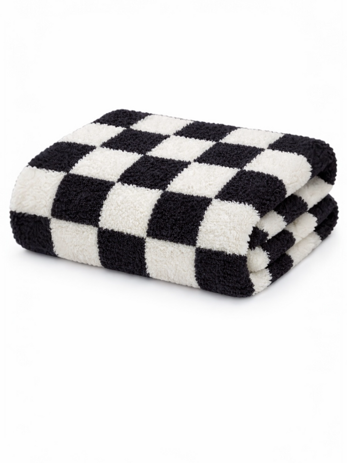 Black and white checkered towel folded neatly on a white background.