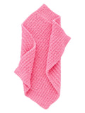 Soft pink textured bath towel folded neatly. Perfect for adding color and comfort to any bathroom decor.