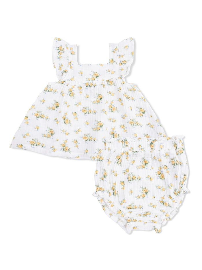 White floral baby dress set with ruffled sleeves and matching bloomers. Perfect for warm weather outfits.