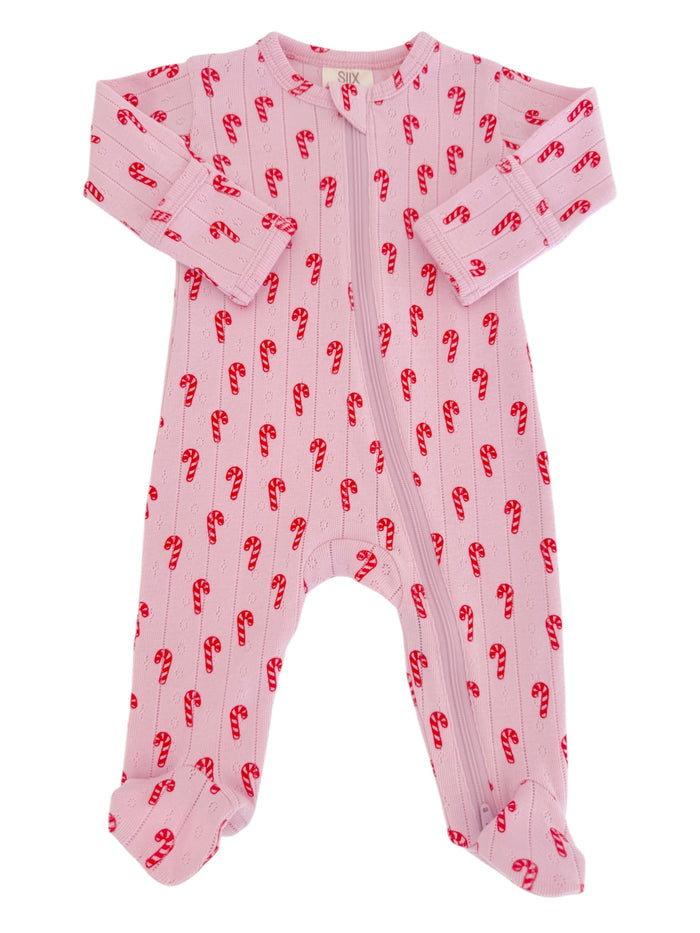 Pink baby onesie with candy cane pattern and long sleeves. Suitable for infants during winter.