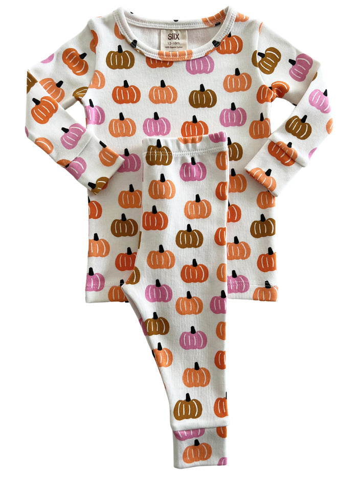 Kids' pajama set featuring colorful pumpkin prints on a white background. Suitable for fall or Halloween wear.