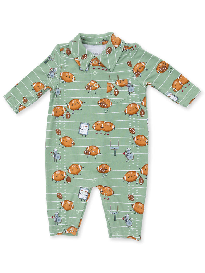 Green baby onesie featuring playful football-themed patterns with happy cartoonish characters.