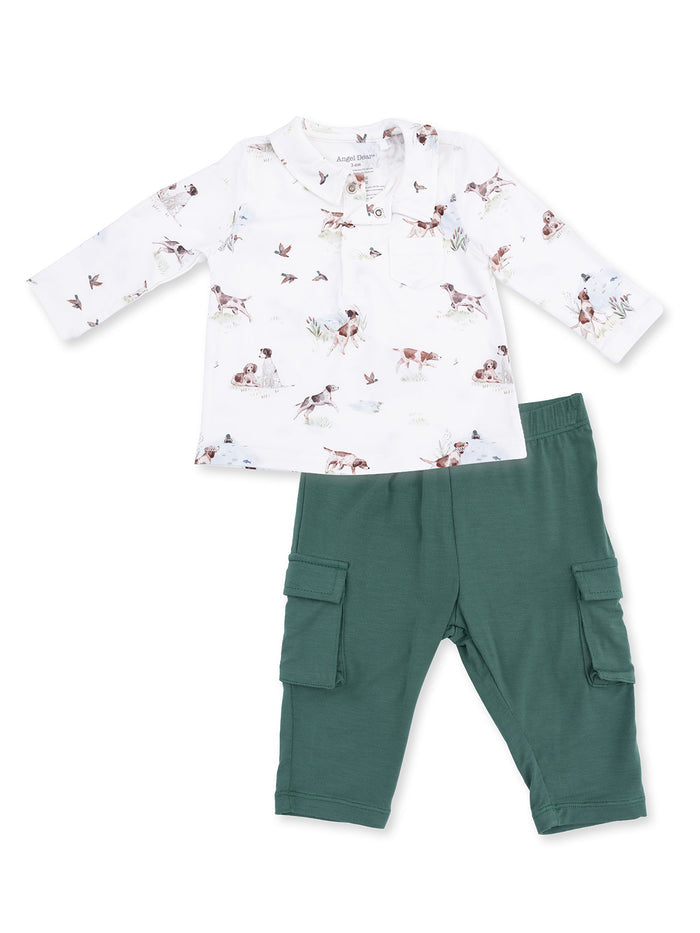 Kids' outfit featuring a long-sleeve top with dog prints and green cargo pants. Perfect for casual play.