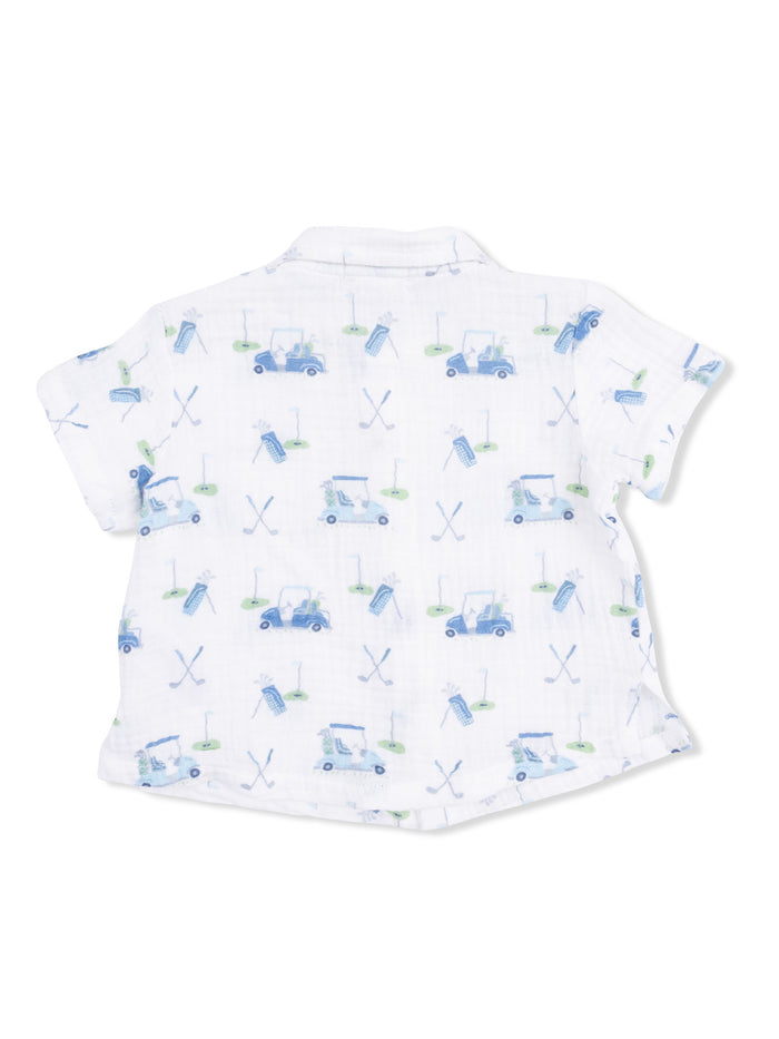 White short-sleeve shirt with a playful golf-themed print, featuring carts, clubs, and golf balls.