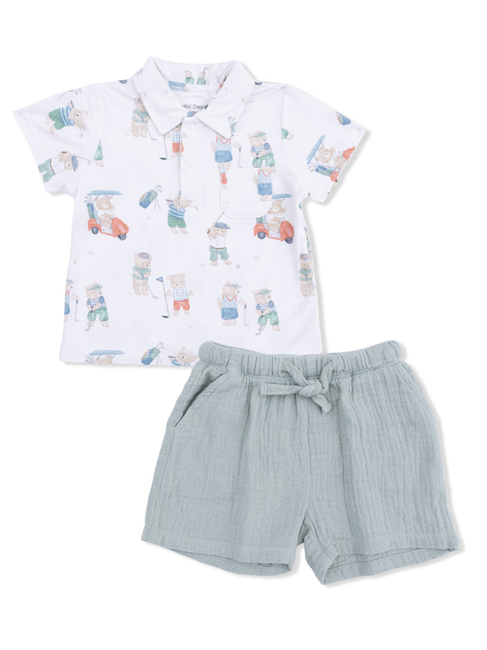 Children's golf-themed polo shirt with shorts, featuring playful bear illustrations in soft colors.