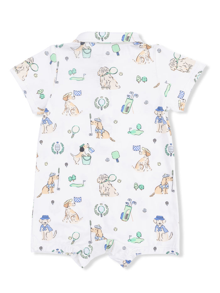 White baby romper with playful dog illustrations and golf-themed elements.