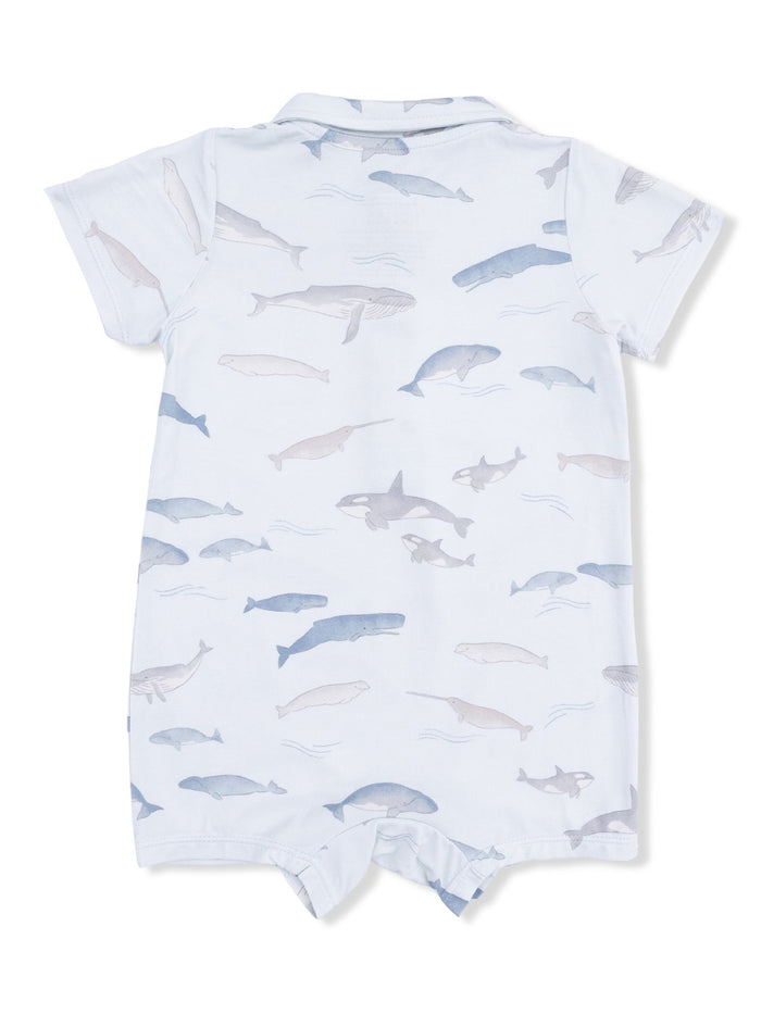 Light blue onesie featuring a playful pattern of various ocean animals, including whales and sharks.