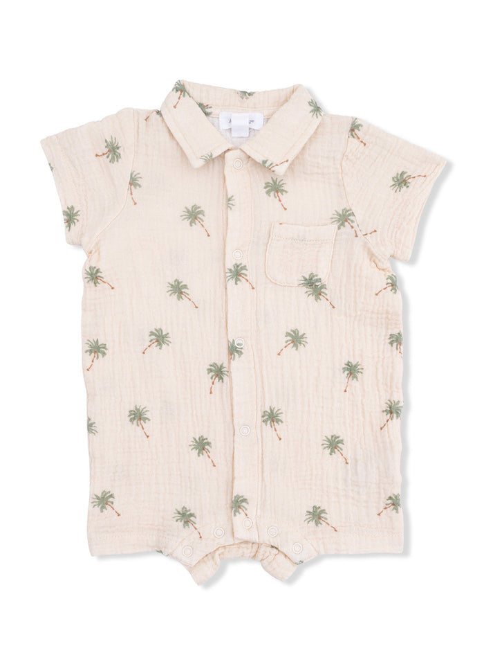 Light-colored infant romper with palm tree print and short sleeves.