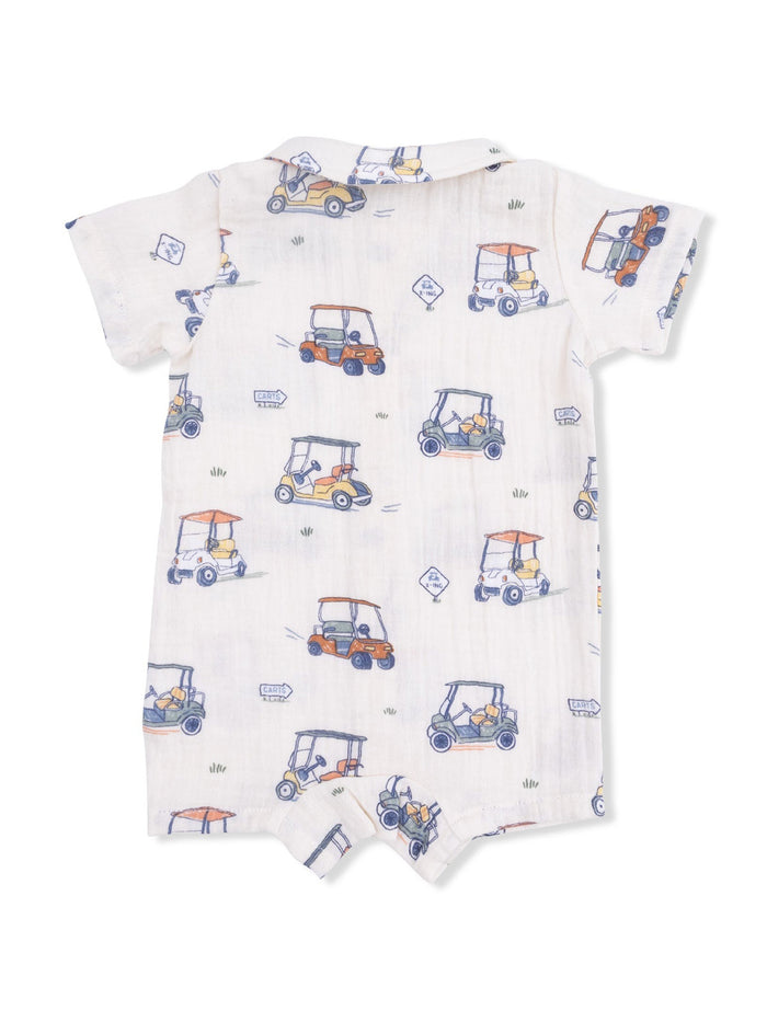 Back view of a children's romper printed with colorful golf carts on a light background.