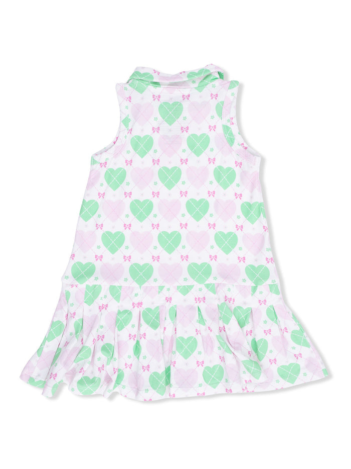 Back view of a sleeveless dress with a heart and bow pattern in green and pink.