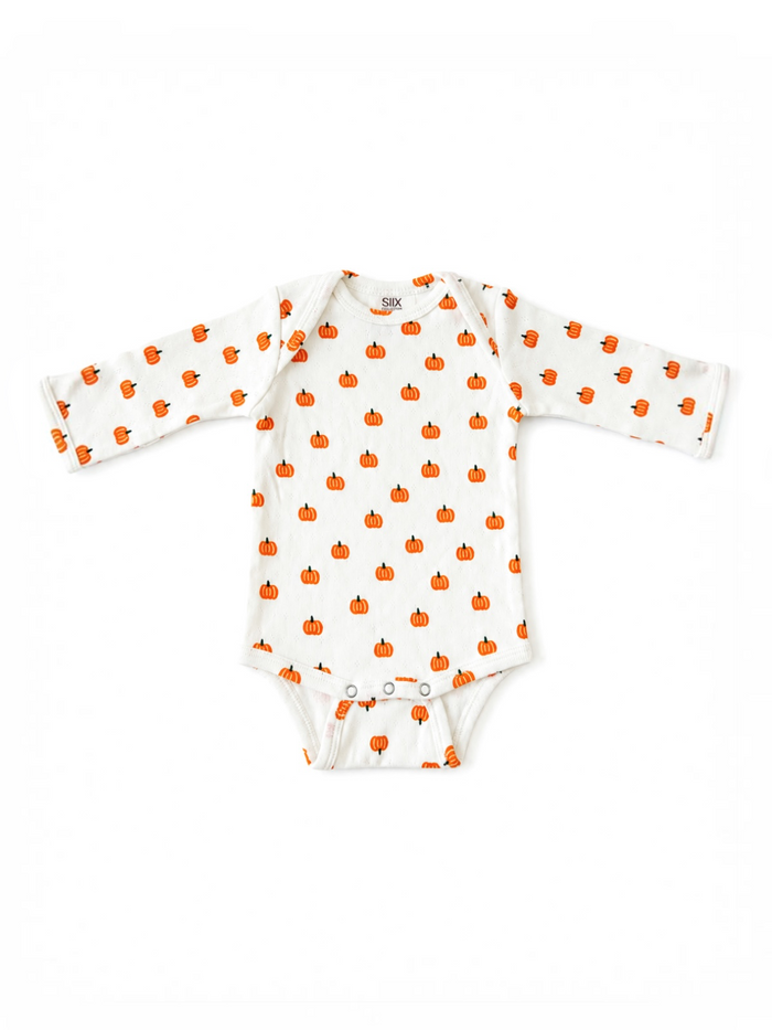 White long-sleeve onesie with a pattern of small orange pumpkins. Perfect for fall or Halloween.