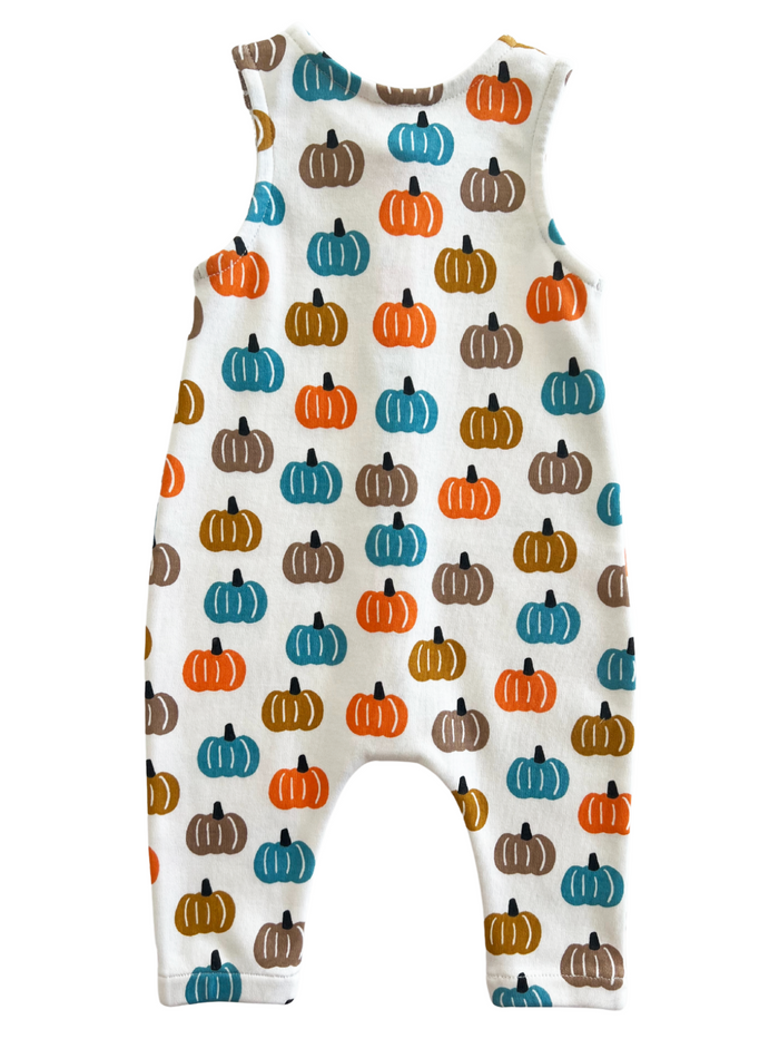 Toddler romper featuring a colorful pumpkin pattern on a white background.