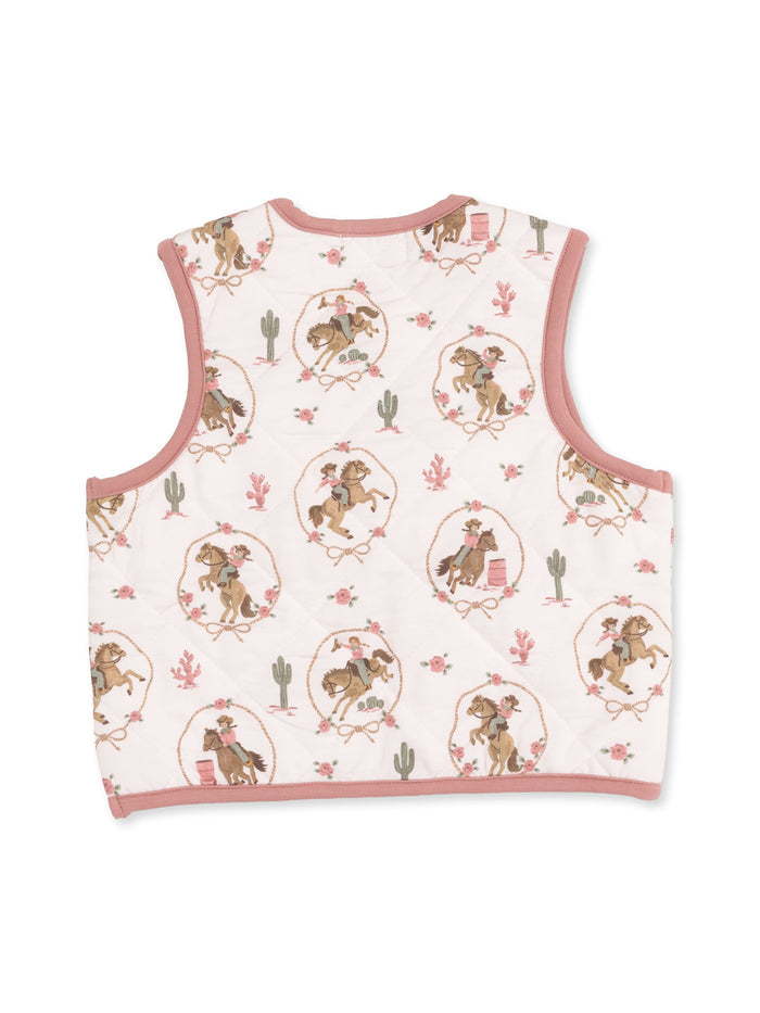 Back of a quilted vest featuring a playful cowboy and cowgirl print with cacti and flowers on a light background.