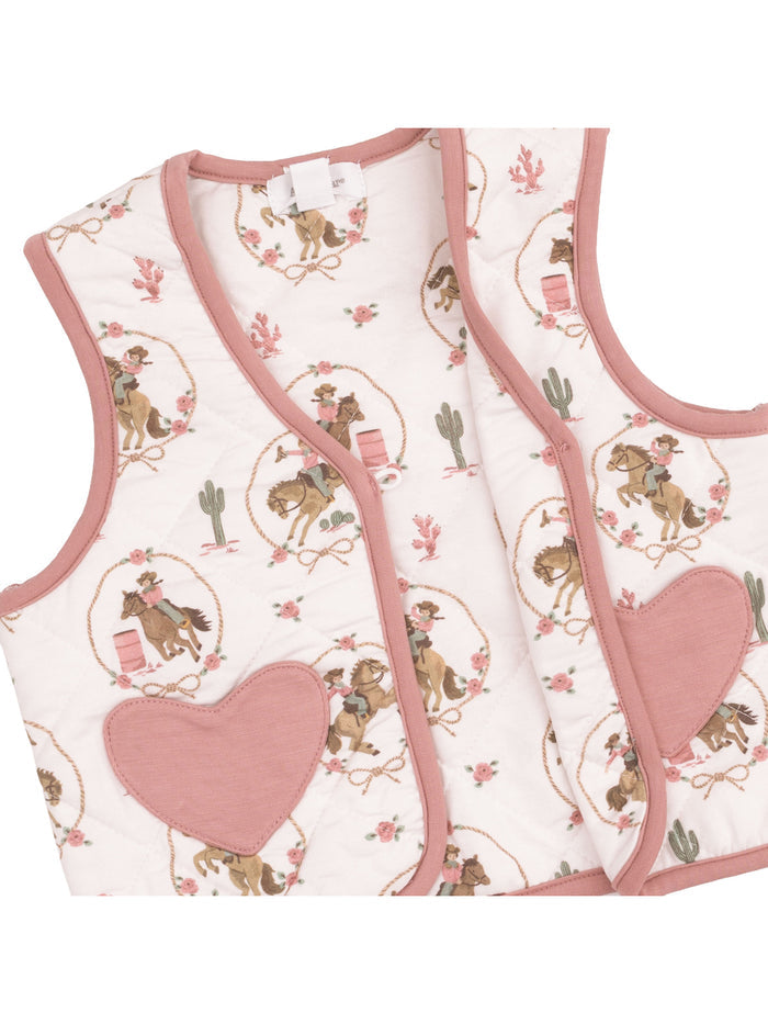 Quilted vest with western-themed print, featuring cowboys, horses, and floral motifs in soft pastel colors.