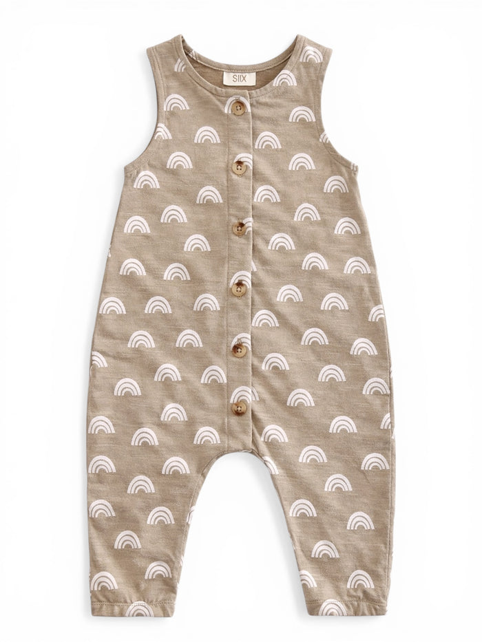 Tan romper with white rainbow patterns and wooden buttons, designed for infants.