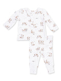 White baby pajama set featuring playful puppy prints on a long-sleeve top and pants.